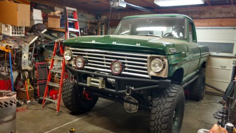 1967 Ford F-250 - This modified 1967 Ford F-250 pickup truck is parked in a garage, its off-road enhancements.