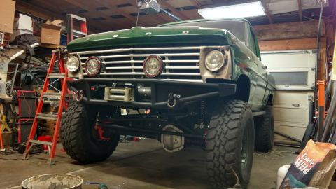 1967 Ford F-250 - Front view of a lifted 1967 Ford F-250 pickup truck with a custom bumper and winch.