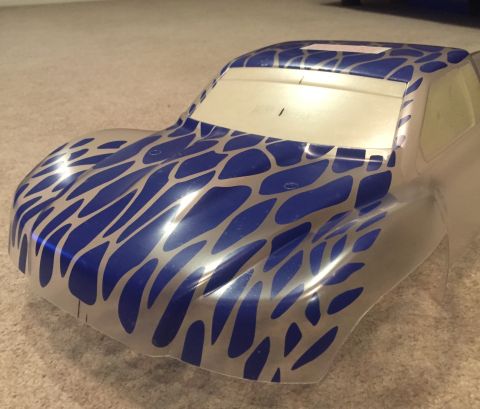 2014 Dodge 1500 - This is a clear plastic RC car body with a blue and silver abstract pattern, viewed from the front 3/4 angle.