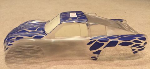 2014 Dodge 1500 - This is a clear plastic RC truck body shell with blue and silver abstract graphics.