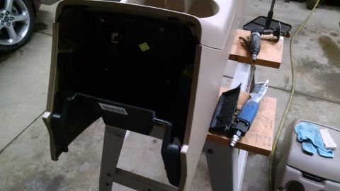1994 Ford Bronco - A disassembled interior dashboard panel is shown with various tools laid out for repair or modification.