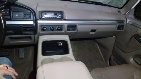 1994 Ford Bronco - Interior view of a 1994 Ford Bronco, the dashboard and center console.