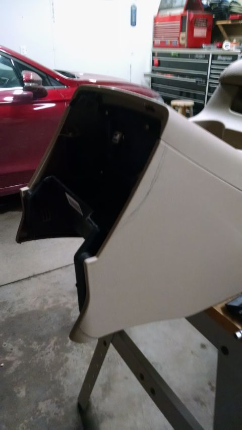1994 Ford Bronco - An interior panel has been removed, revealing a dark cavity and some wiring beneath.