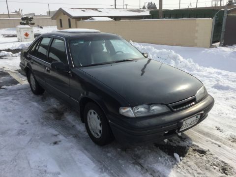 1995 Holden Astra - This 1995 Holden Astra sedan is parked on a snow-covered surface.
