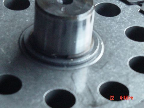 1987 Ford Bronco - A close-up view of a metal component, possibly from a vehicle's engine or transmission, with visible text overlay.
