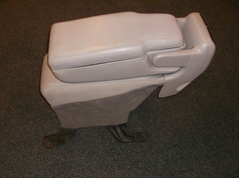 1999 Mercury Grand Marquis - A car's center console armrest, likely from a sedan, is shown removed from the vehicle.