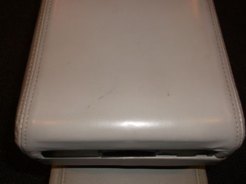 1999 Mercury Grand Marquis - Close-up of a vehicle's center console lid, showing its material and construction details.