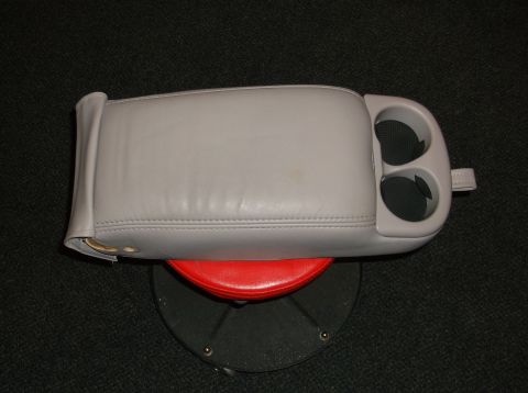 1999 Mercury Grand Marquis - A gray center console with integrated cupholders is shown against a dark background.