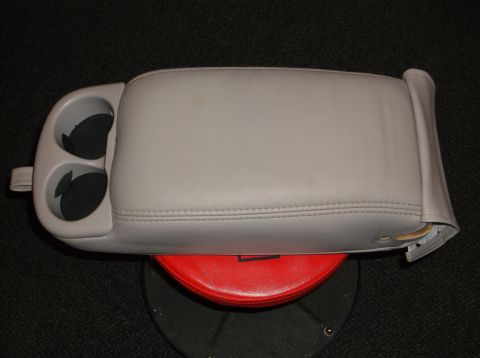 1999 Mercury Grand Marquis - A gray center console with two cup holders is shown, detached from a vehicle.