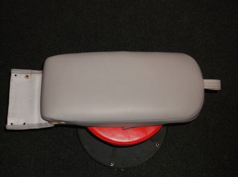 1999 Mercury Grand Marquis - A gray center console armrest is shown, with a fabric flap attached to the left side.