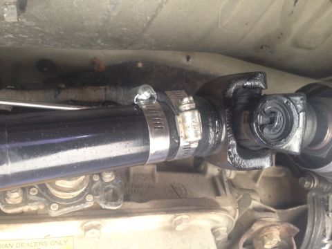 2001 Ford Ranger - Close-up view of a vehicle's driveshaft and universal joint assembly.