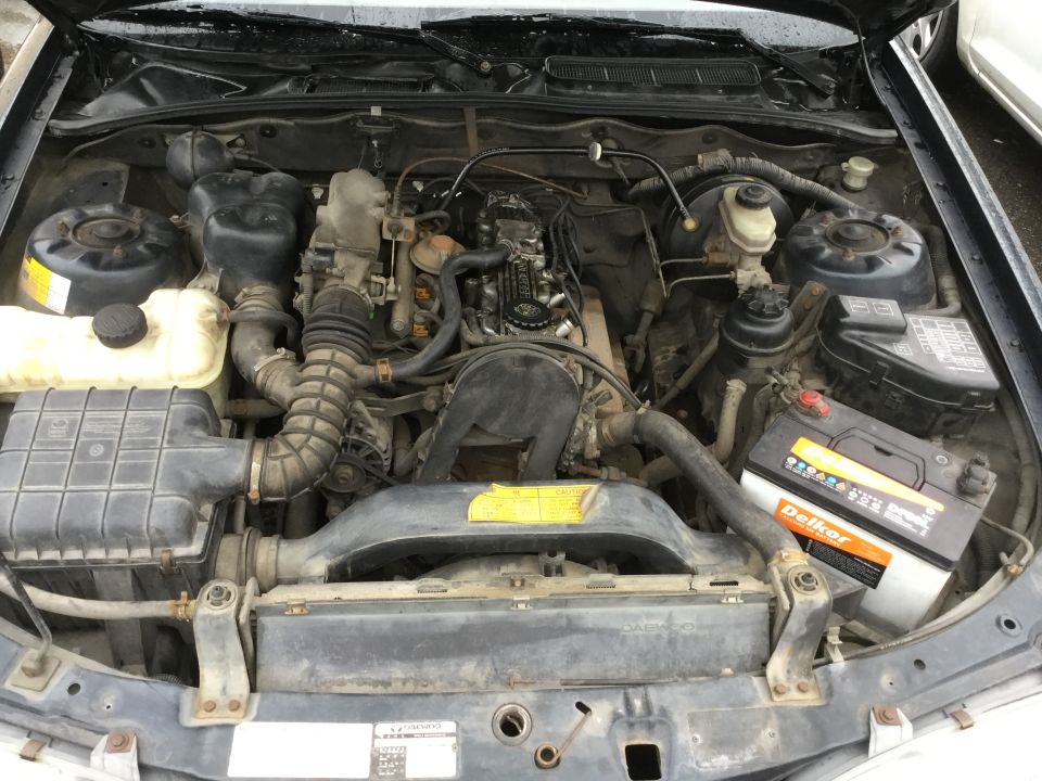 Engine bay with Delkor battery and Supermotors.net logo