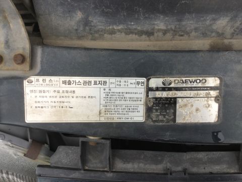 1995 Holden Astra - Vehicle certification plate shows model and engine information.