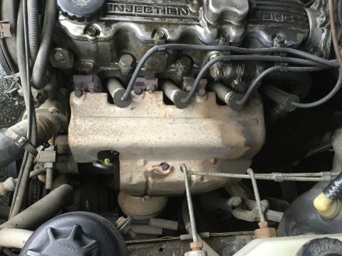 1995 Holden Astra - Close-up view of an engine compartment, showing internal components and wiring.