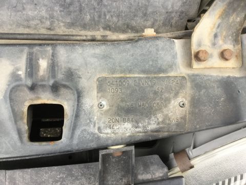 1995 Holden Astra - Close-up of a vehicle's VIN plate, showing various alphanumeric codes and numbers.