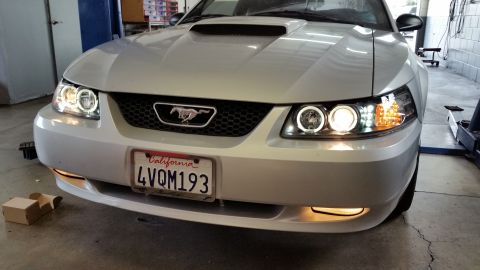 2002 Ford Mustang - Front view of a 2002 Ford Mustang showing its updated halo headlights and grille emblem.