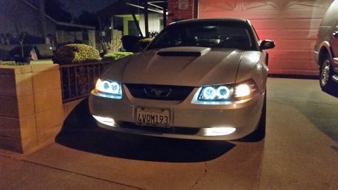 2002 Ford Mustang - This 2002 Ford Mustang features custom halo headlights and a modified grille, seen at night.