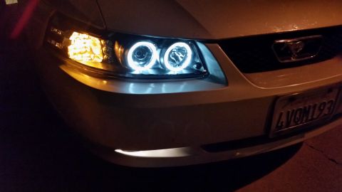 2002 Ford Mustang - Front view of a 2002 Ford Mustang showing its distinctive halo headlights and grille emblem.