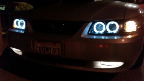 2002 Ford Mustang - A 2002 Ford Mustang is shown from the front, aftermarket halo headlights and a license plate.