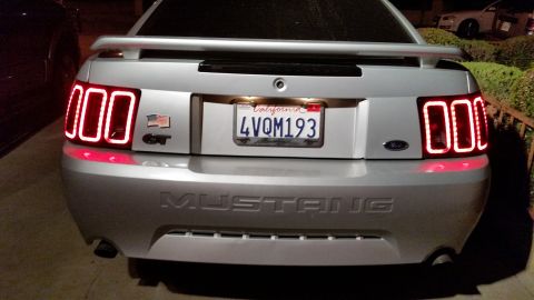 2002 Ford Mustang - Rear view of a 2002 Ford Mustang GT showing custom LED tail lights and the California license plate.