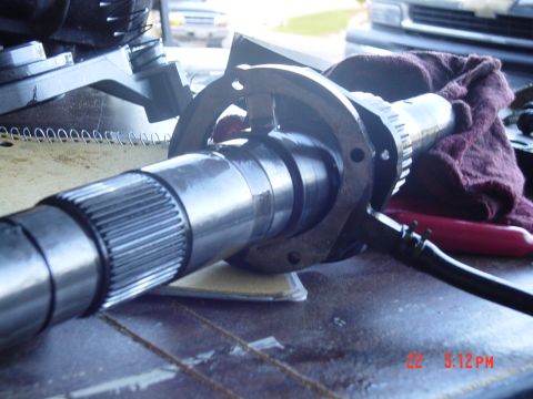 1987 Ford Bronco - Close-up of a differential housing and axle shaft, likely part of a manual swap project.