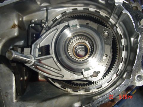 1987 Ford Bronco - Internal view of an automatic transmission, showing gears and a shift lever mechanism.