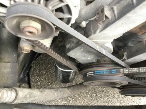 1995 Holden Astra - Engine belts and pulleys are visible, with some text on one of the belts indicating 'GM DAEWOO'.