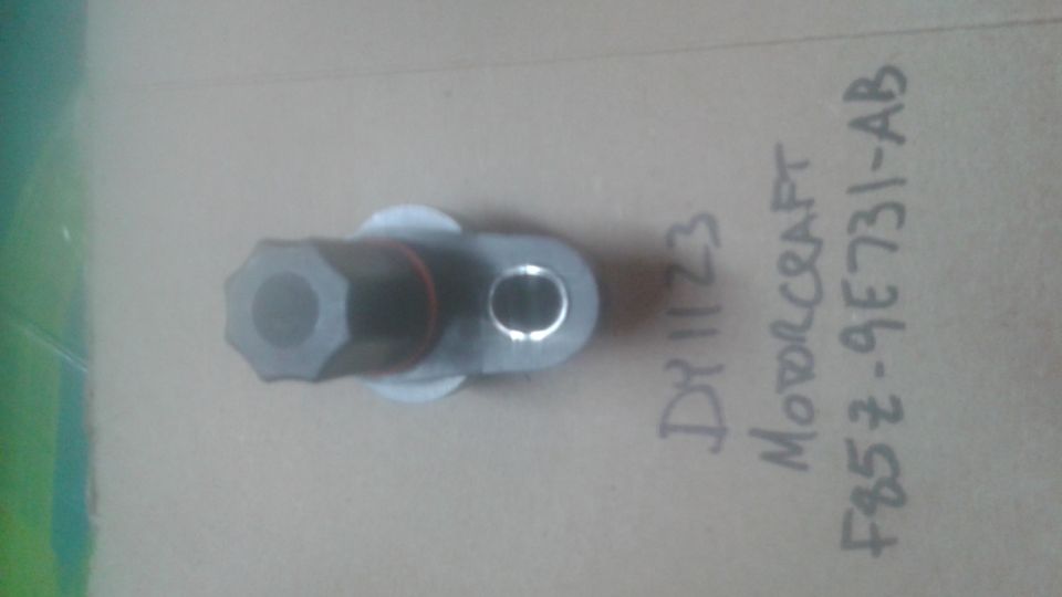 Motorcraft vehicle speed sensor with part number F85Z-9E731-AB and handwritten date DY1123