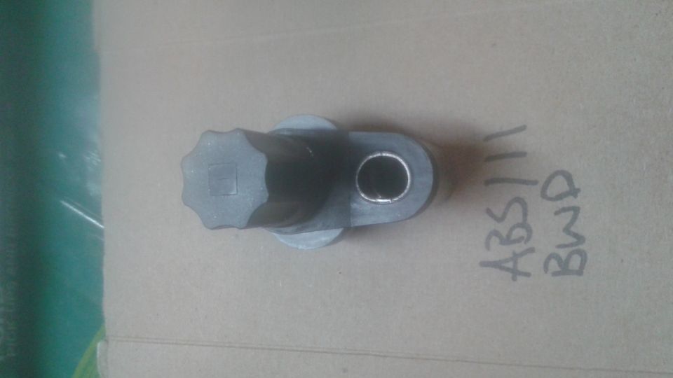 Gray automotive part with 'ABS111 BWD' written on it