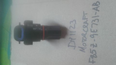 1996 Ford Bronco - A close-up of a vehicle speed sensor with handwritten part numbers and brand name.