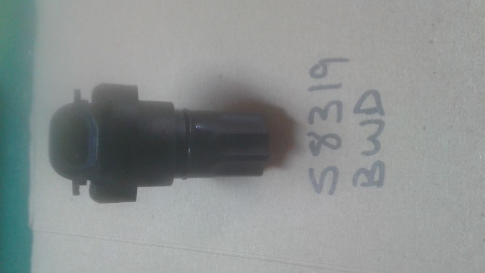 Black sensor part with handwritten text 'S8319 BWD'