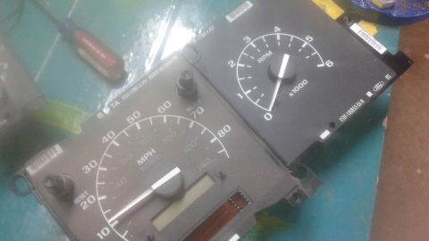 1996 Ford Bronco - Instrument cluster gauges, including a speedometer and tachometer, with a visible Ford logo.