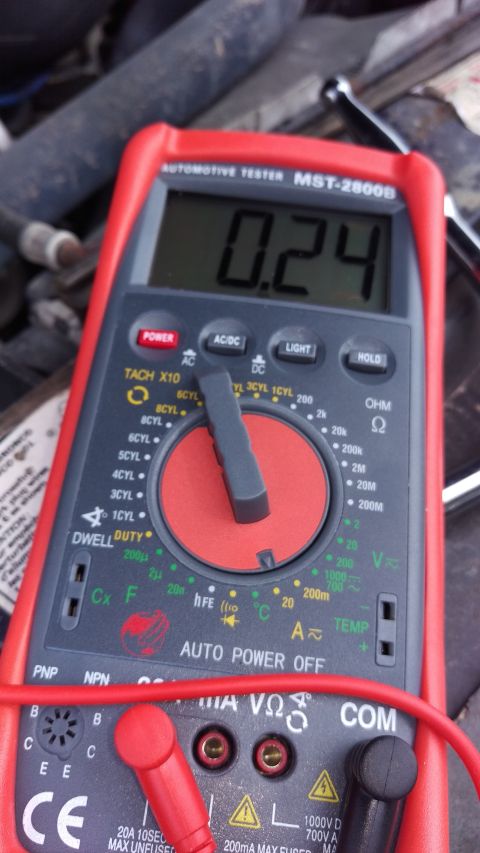 1994 Ford Bronco - Automotive multimeter reads 0.24 amps, likely indicating parasitic drain.