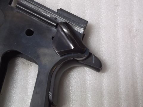 1995 Mercury Grand Marquis - Close-up view of a firearm's frame and trigger assembly, showing internal components.