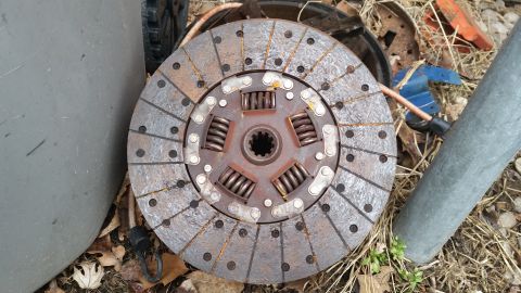 1981 Ford Bronco - A rusty clutch disc with springs and a splined hub is visible.