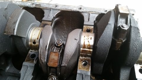 1981 Ford Bronco - Close-up view of an engine's internal components, including the crankshaft and connecting rods.