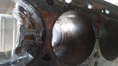1981 Ford Bronco - Engine cylinder block showing wear and oil residue inside the cylinders.
