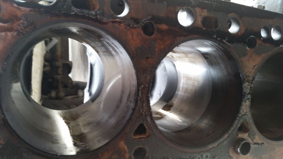 close-up of engine block cylinders, showing wear marks inside