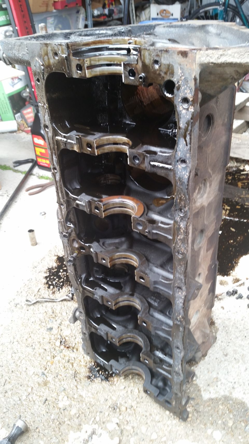 Used engine block with bearing caps visible inside