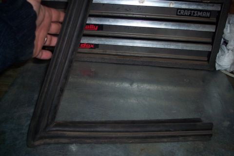 1990 Ford Bronco - A rubber gasket is shown in front of a toolbox, with Supermotors.net branding at the bottom.
