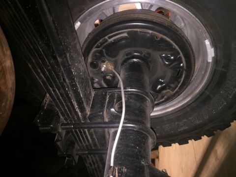 1982 Ford Bronco - Close-up view of a vehicle's rear axle and suspension components, with a watermark indicating the source.