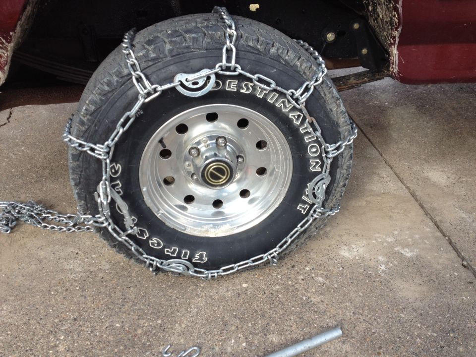 Tire with snow chains on it, close up