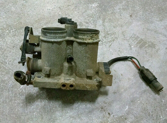 Used throttle body assembly with two intake ports and electrical connector