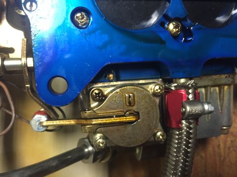 1982 Ford Bronco - Carburetor linkage and braided fuel line detail.