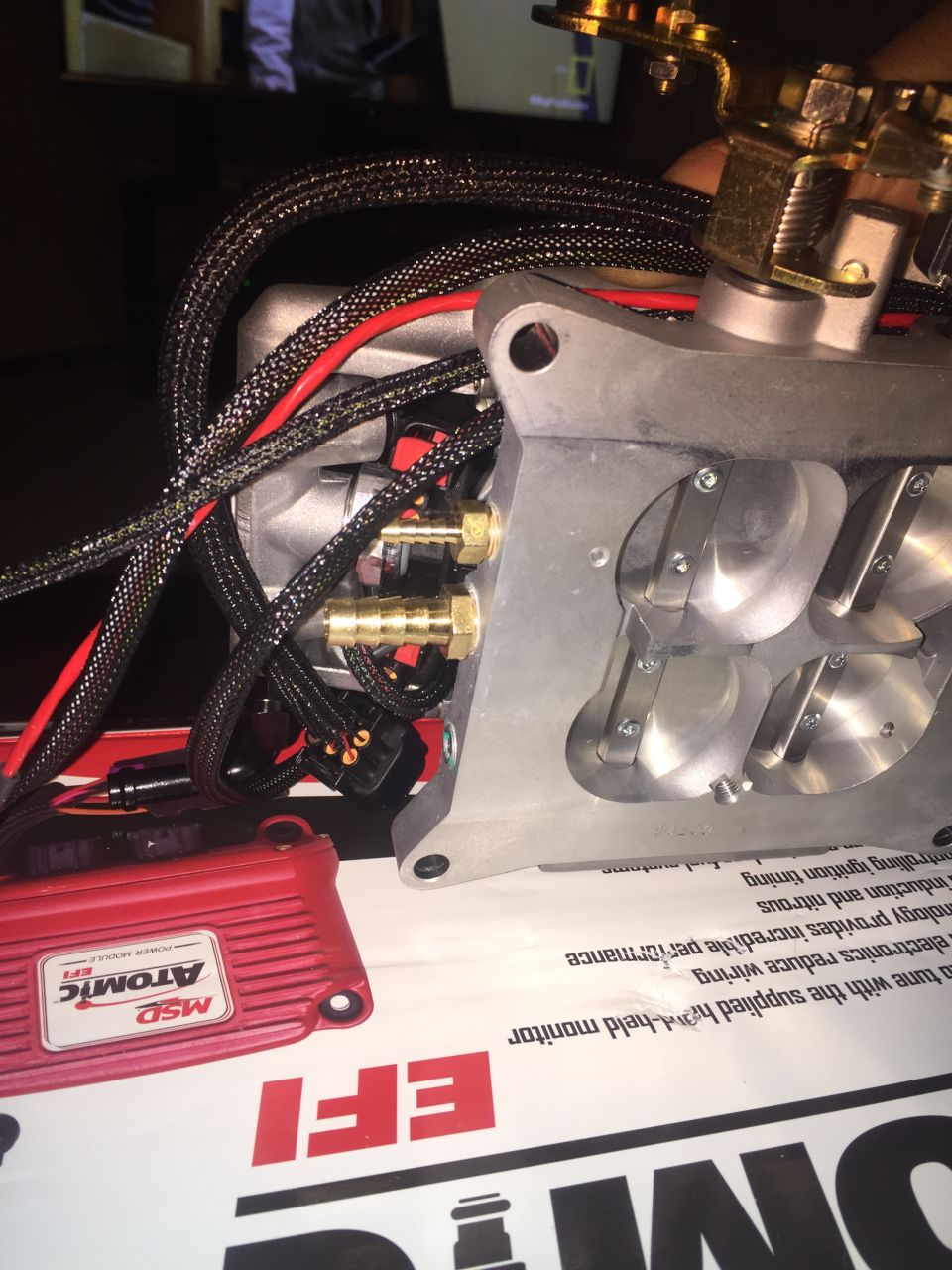 Close-up of engine part with wiring and MSD Atomic EFI module