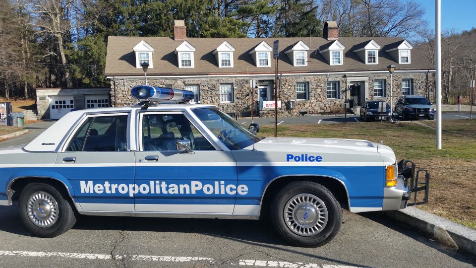 Metropolitan Police Ford Crown Victoria cruiser with push bar at stone station