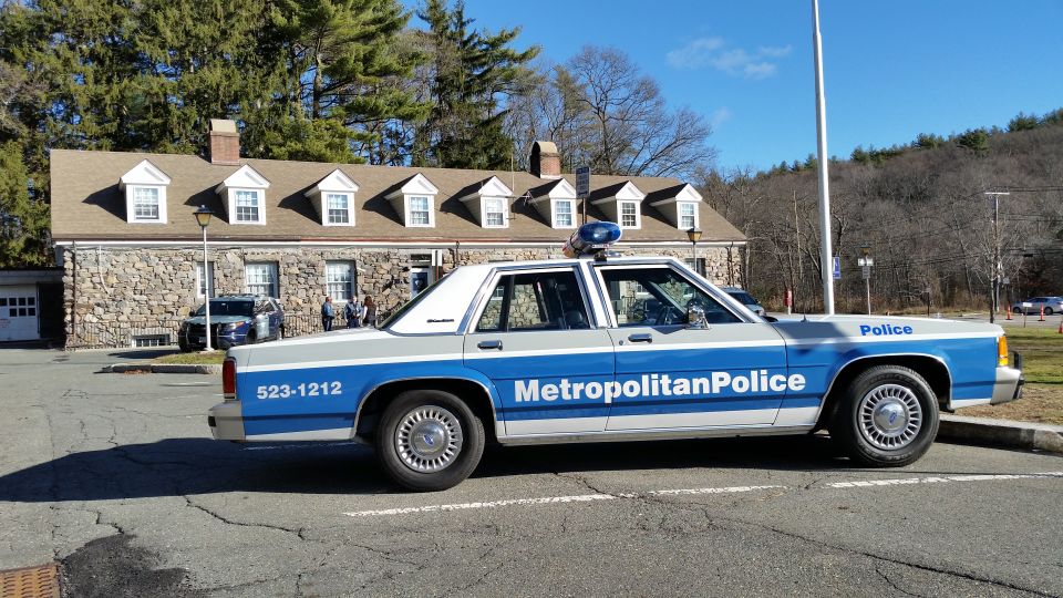 Metropolitan Police Ford Crown Victoria cruiser parked at stone police station