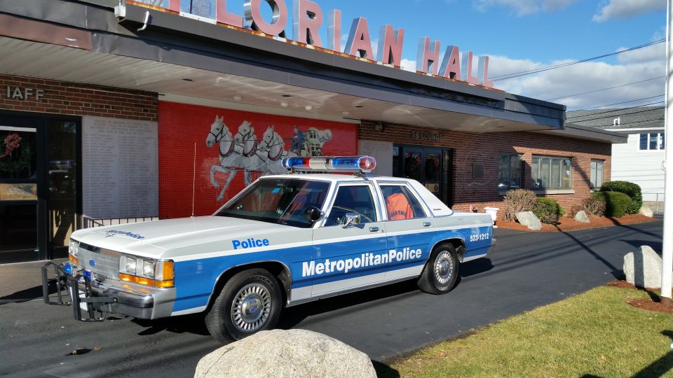 Metropolitan Police Ford sedan parked outside Florian Hall