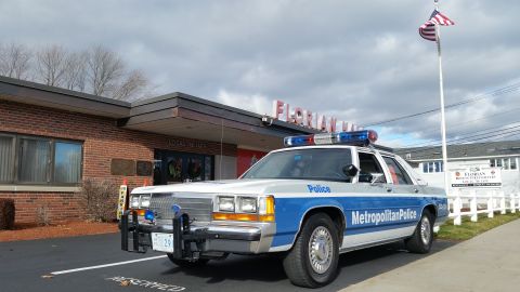 1991 Ford LTD Crown Victoria - Photo of a Metropolitan Police Ford Crown Victoria cruiser parked outside Florian Hall, not a technical document.