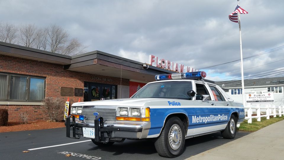 Ford Crown Victoria Metropolitan Police car parked outside a brick building